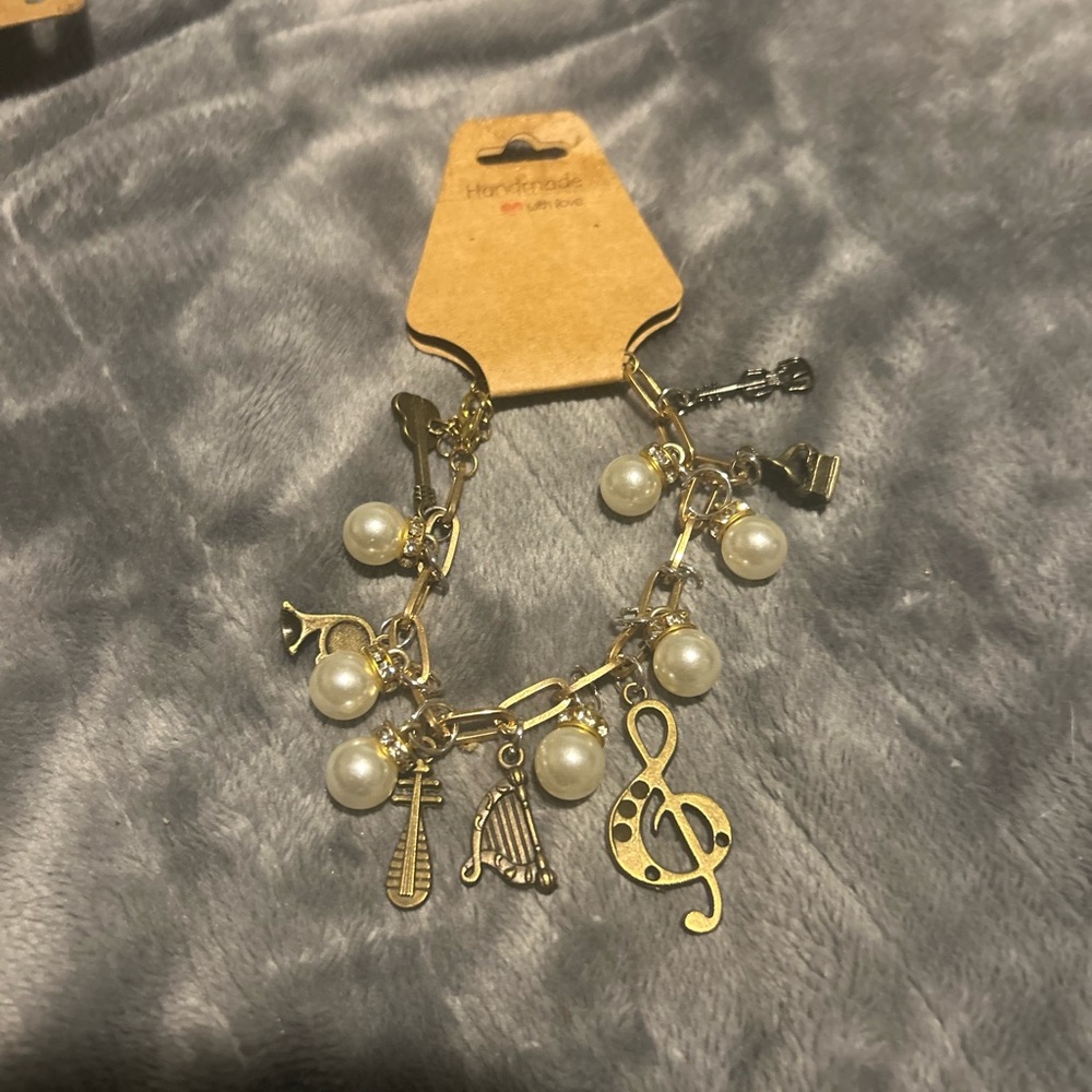 Gold and White Charm Bracelet with Delicate Charms